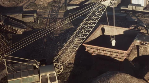 Heavy machinery operates in a mining site during daylight hours Stock Footage 343944228