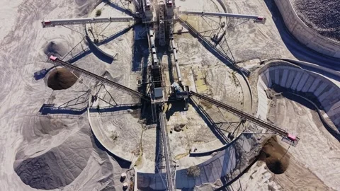 Heavy machinery operates at a sand and gravel extraction site Stock Footage 344539967