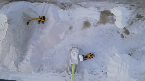 Heavy machinery work in open air salt mine.Salt excavation process Stock Footage 229701611