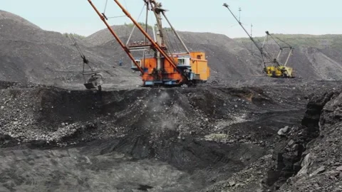 Heavy Machinery Working in Coal Mining Site Resource Extraction 動画素材 334563219