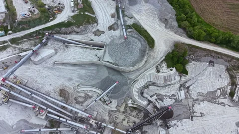 Heavy machinery works at a construction site to transport materials for building Stock Footage 340179256