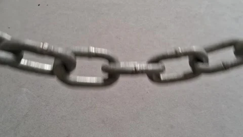 Heavy metal chain links moving in a steady rhythmic video animation Stock Footage 339374530