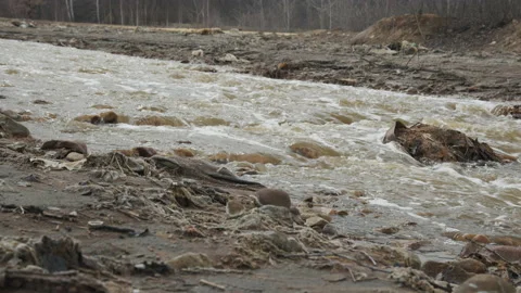 Heavy metals and junk by the river stream 4K slow motion video Stock Footage 159267314