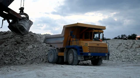 Heavy mining dump truck being loaded with iron ore Stock Footage 33827445