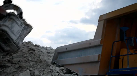 Heavy mining dump truck being loaded with iron ore Stock Footage 33827548