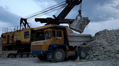 Heavy mining dump truck being loaded with iron ore Stock Footage 33827557