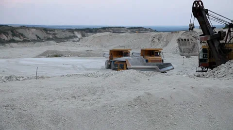 Heavy mining dump truck being loaded with iron ore Stock Footage 33827682