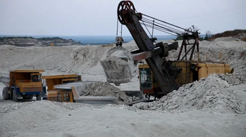 Heavy mining dump truck being loaded with iron ore 스톡 동영상 33828259