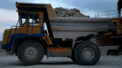 Heavy mining dump truck being loaded with iron ore Stock Footage 33828353