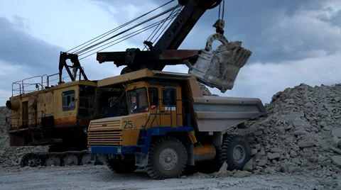 Heavy mining dump truck being loaded with iron ore Stock Footage 38499894