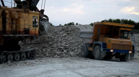 Heavy mining dump truck being loaded with iron ore Stock Footage 38539030
