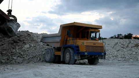 Heavy mining dump truck being loaded with iron ore Stock Footage 38540911