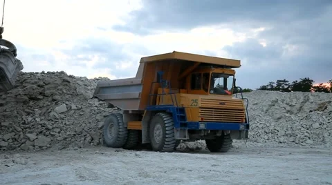 Heavy mining dump truck being loaded with iron ore Video stock 44121224