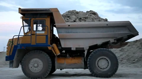 Heavy mining dump truck being loaded with iron ore Video stock 44122389