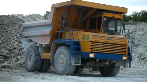 Heavy mining dump truck being loaded with iron ore Stock Footage 63993525
