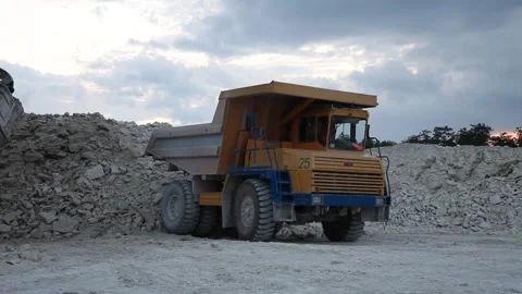Heavy mining dump truck being loaded with iron ore Stock Footage 128754595