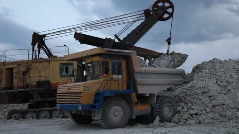 Heavy mining dump truck being loaded with iron ore Stock Footage 128754607