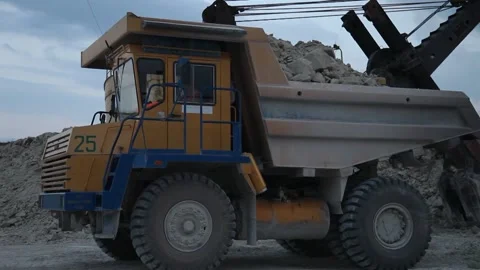 Heavy mining dump truck being loaded with iron ore Stock Footage 128754795