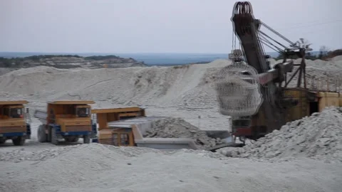 Heavy mining dump truck being loaded with iron ore Stock Footage 128754891
