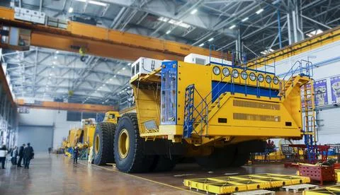 Heavy mining dump trucks are at the factory. Stock Photos