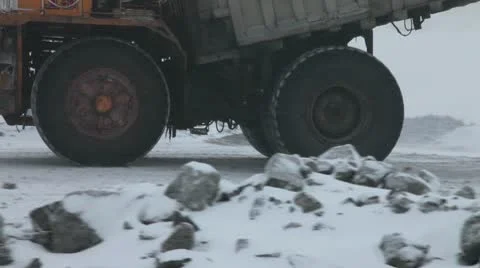 Heavy mining dump trucks driving along the opencast Stock Footage 10773603