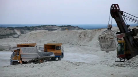 Heavy mining dump trucks driving along the opencast Stock Footage 58786107