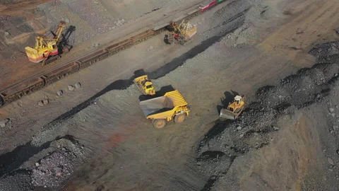 Heavy mining machinery in a quarry for the extraction of limestone, industrial Stock Footage 135647720