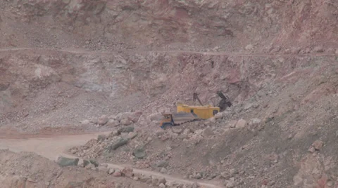 Heavy mining machinery is working in an open pit mine Stock Footage 29658754