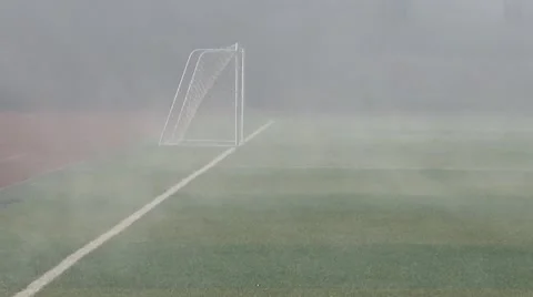 Heavy mist flowing on the empty soccer playground in a high school Stock Footage 44982104