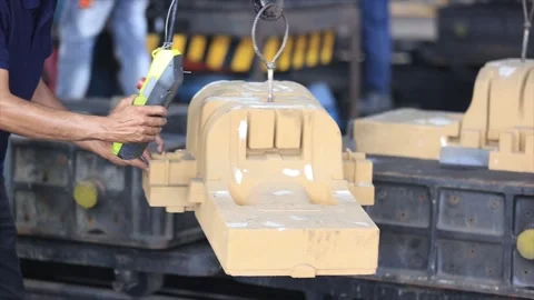 Heavy mold pattern is carefully lifted, demonstrating the blend in casting Stock Footage 312986410