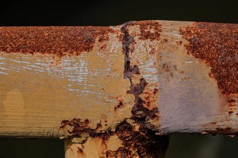 Heavy orange rust on iron railing profile Photos