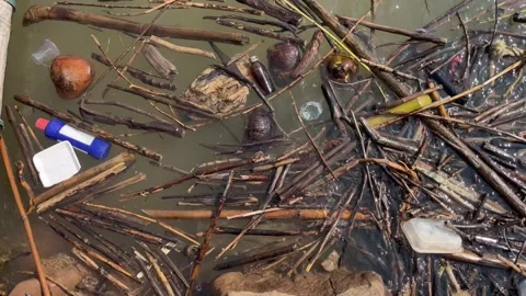 Heavy plastic garbage and organic waste floating on river surface Stock Footage 330719095