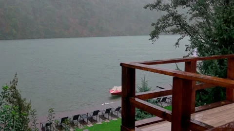 Heavy pouring rain over mountain lake Stock Footage 141847873