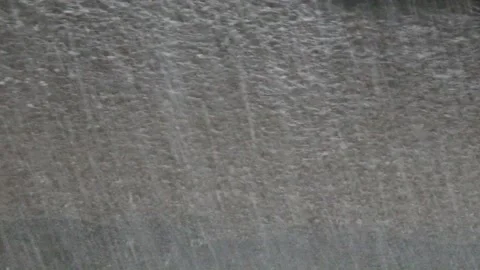 Heavy rain against the tree and a children's playground streams of water Stock Footage 143338910