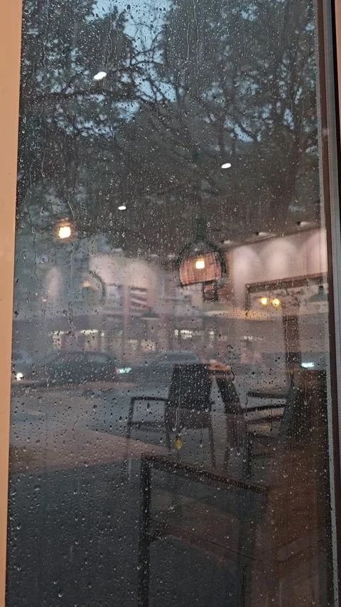 Heavy Rain and Severe Storm Seen Through Cafe Window Stock Footage 344311699