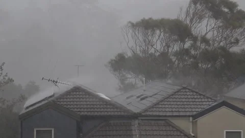 Heavy rain and storm falling into buildings roof Stock Footage