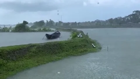 Heavy Rain and Strong Wind over Calm River with Tethered Wooden Boat. Stock Footage 335354255