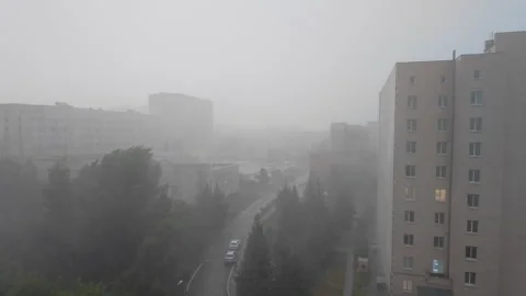 Heavy Rain and Strong Wind Sweeping Through Urban Residential District Duri.. Video stock 342594008