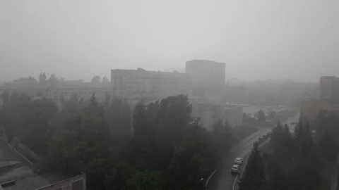 Heavy Rain and Strong Wind Sweeping Through Urban District During Severe Stor Stockbeeldmateriaal 343550527