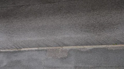 Heavy rain and thunderstorm over an asphalt road Stock Footage 338230278