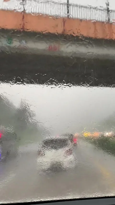Heavy Rain and Traffic Seen Through Wet Windshield on Highway Stock Footage 337318696
