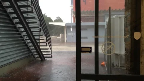 Heavy rain and wind outside business Stock Footage 345010182