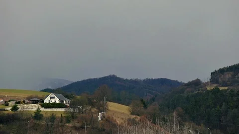 Heavy rain and wind time lapse. Fast moving clouds over lonely house on the hill Stock Footage 116033914