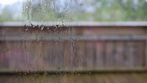 Heavy rain and wind. View through the window. The sound of rain. Stock Footage 97578696