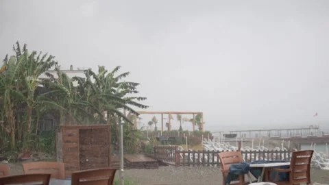 Heavy rain on a beach in Turkey in November Stock Footage 220830122