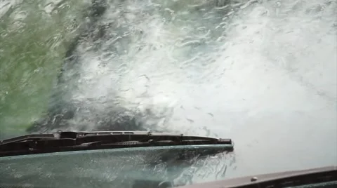 Heavy rain on car wind screen view from outside car. Stock Footage 50588458
