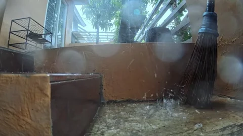 Heavy rain caused puddles around the terrace of the house Stock Footage 295609815