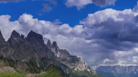 Heavy rain clouds roll over an Italian mountain range. Time lapse. Stock Footage 68340309