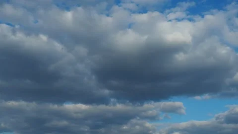 Heavy rain clouds rush through the blue sky. Weather forecast. Climate change Stock Footage 239944796