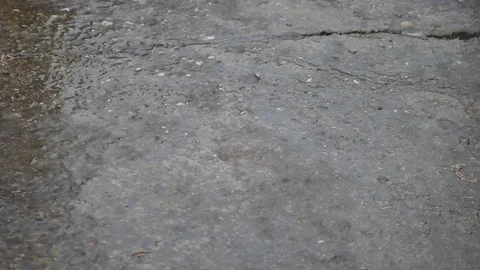 Heavy Rain on Concrete Stock Footage 90784336